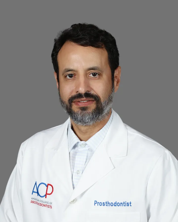 Dr. Roy Rosado, prosthodontist, with the American College of Prosthodontists logo